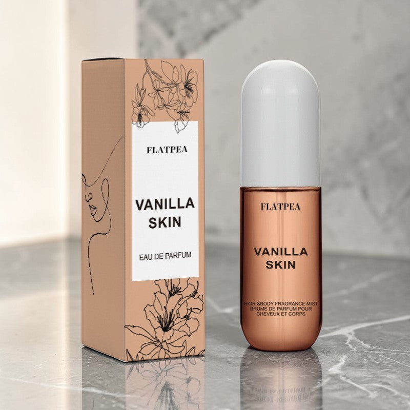 Vanilla Coconut fragrance spray and body perfume in elegant packaging on a marble surface.