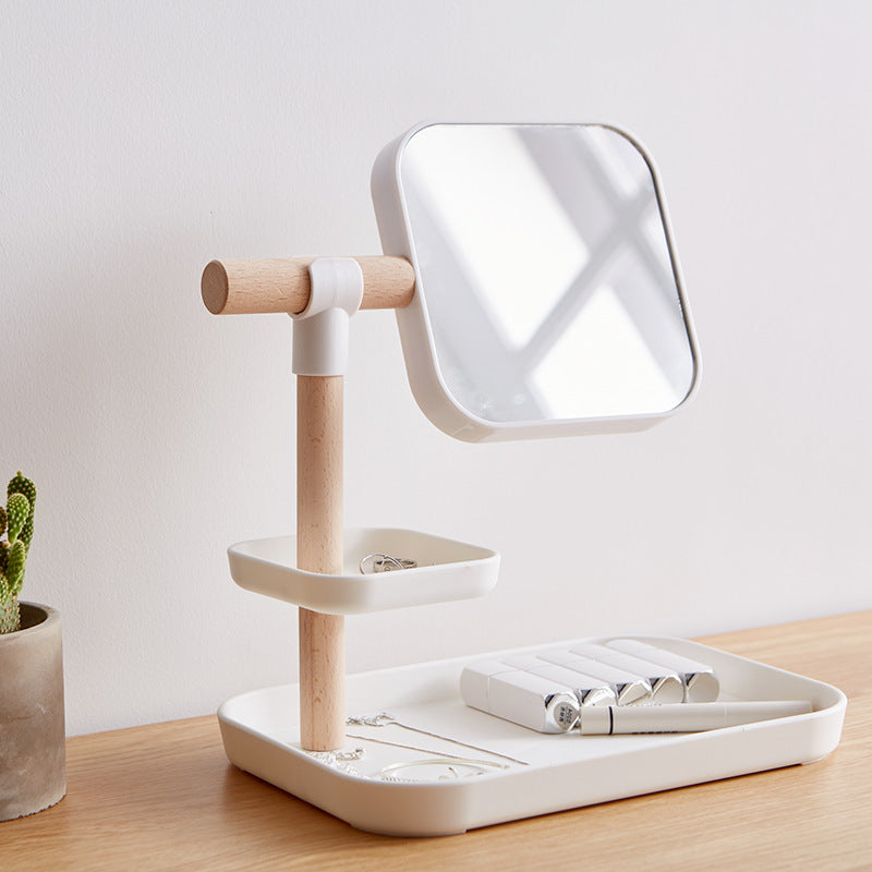 Cosmetics Storage Box with Mirror on a stylish counter with jewelry and beauty products organized.