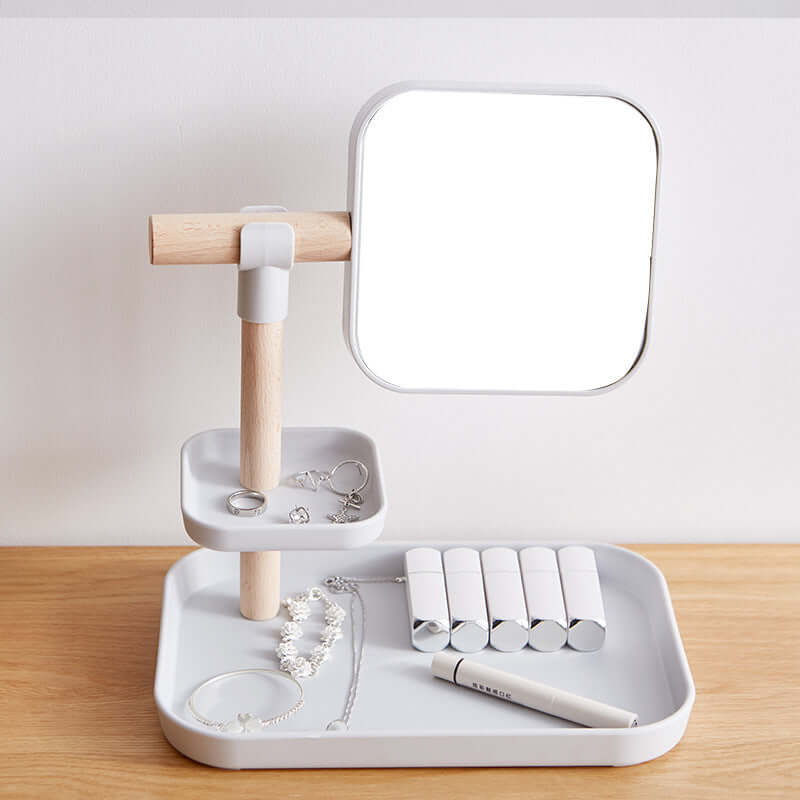 Cosmetics Storage Box with Mirror on a stylish counter with jewelry and beauty products organized.