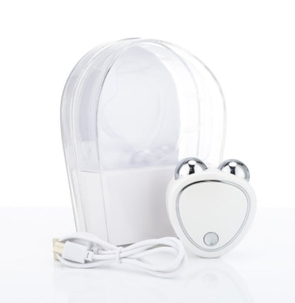 Microcurrent beauty massager in pink with charging cable and clear case for skincare enhancement.