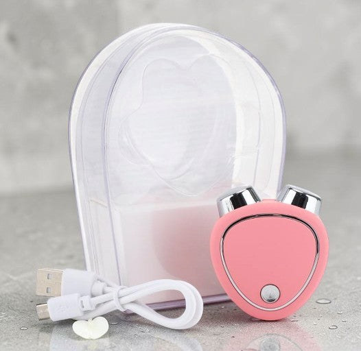 Microcurrent beauty massager in pink with charging cable and clear case for skincare enhancement.